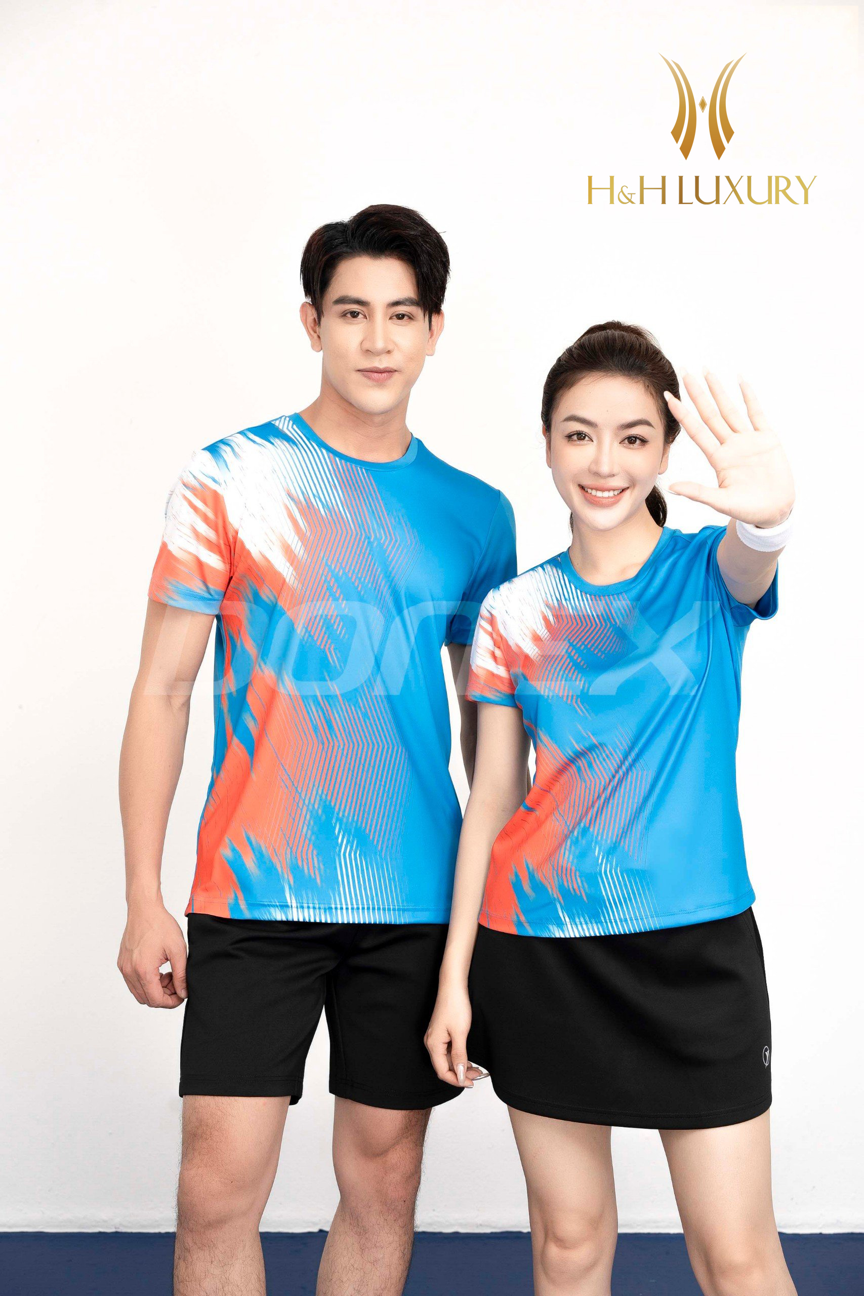 ÁO THỂ THAO NỮ XANH COPAN PHỐI CAM