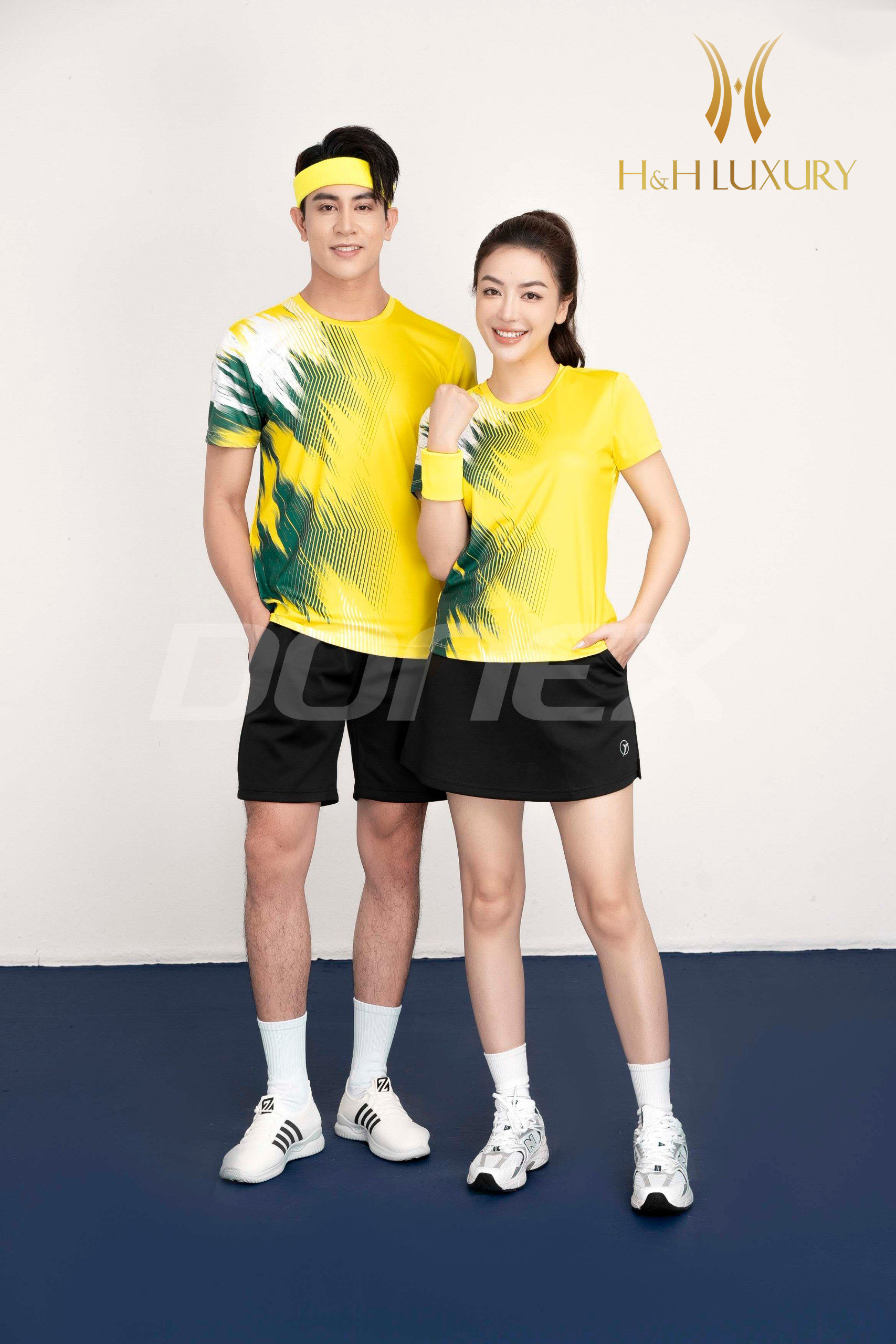 ÁO THỂ THAO NỮ VÀNG PHỐI XANH LỤC BẢO