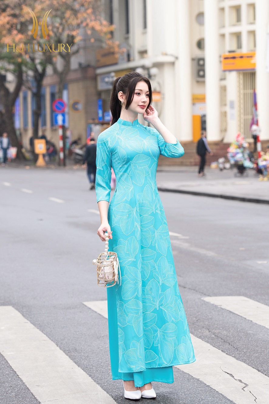 ÁO DÀI LỤA MỸ HỌA TIẾT LÁ XANH NƯỚC BIỂN